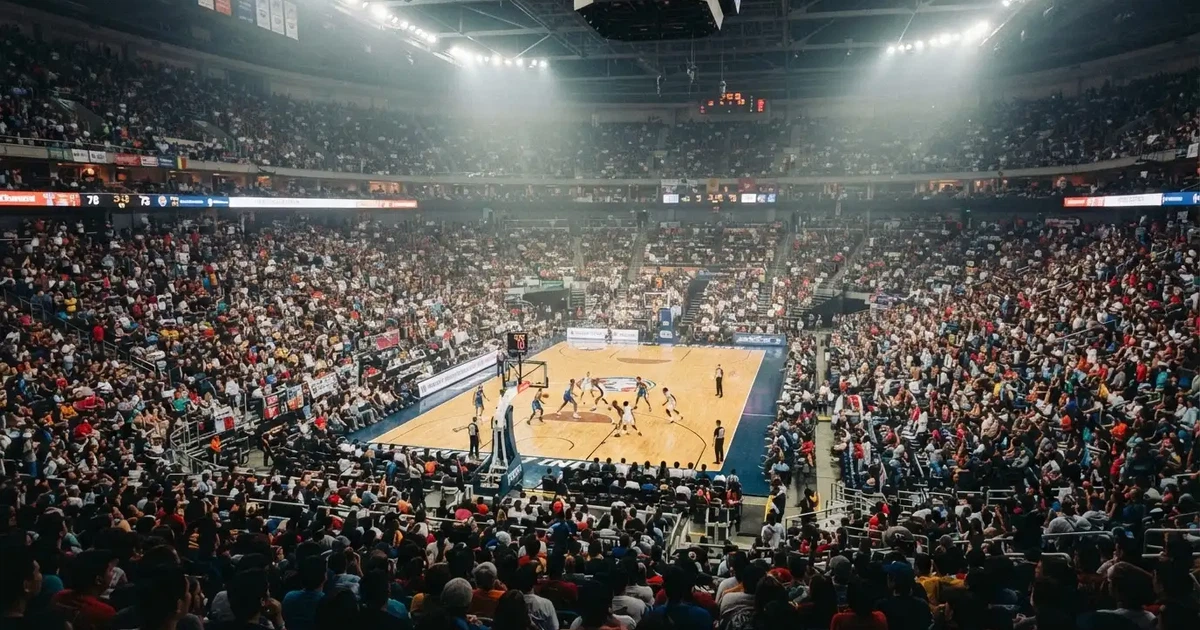 Un pabellón deportivo lleno bajo los focos, fotografiado desde muy lejos